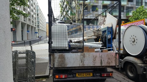 Man and van team loading furniture from a Victorian flat in Queens Park