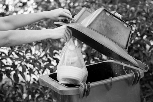 Recycling bins for different materials in Queens Park