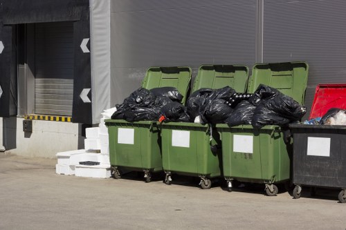 Workers efficiently removing construction debris from a site